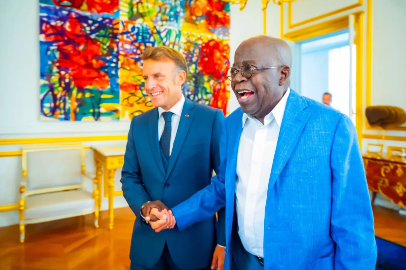 Tinubu-in-a-warm-exchange-with-Macron-at-the-Elysee-Palace-in-Paris.-2-1392x929-1.webp